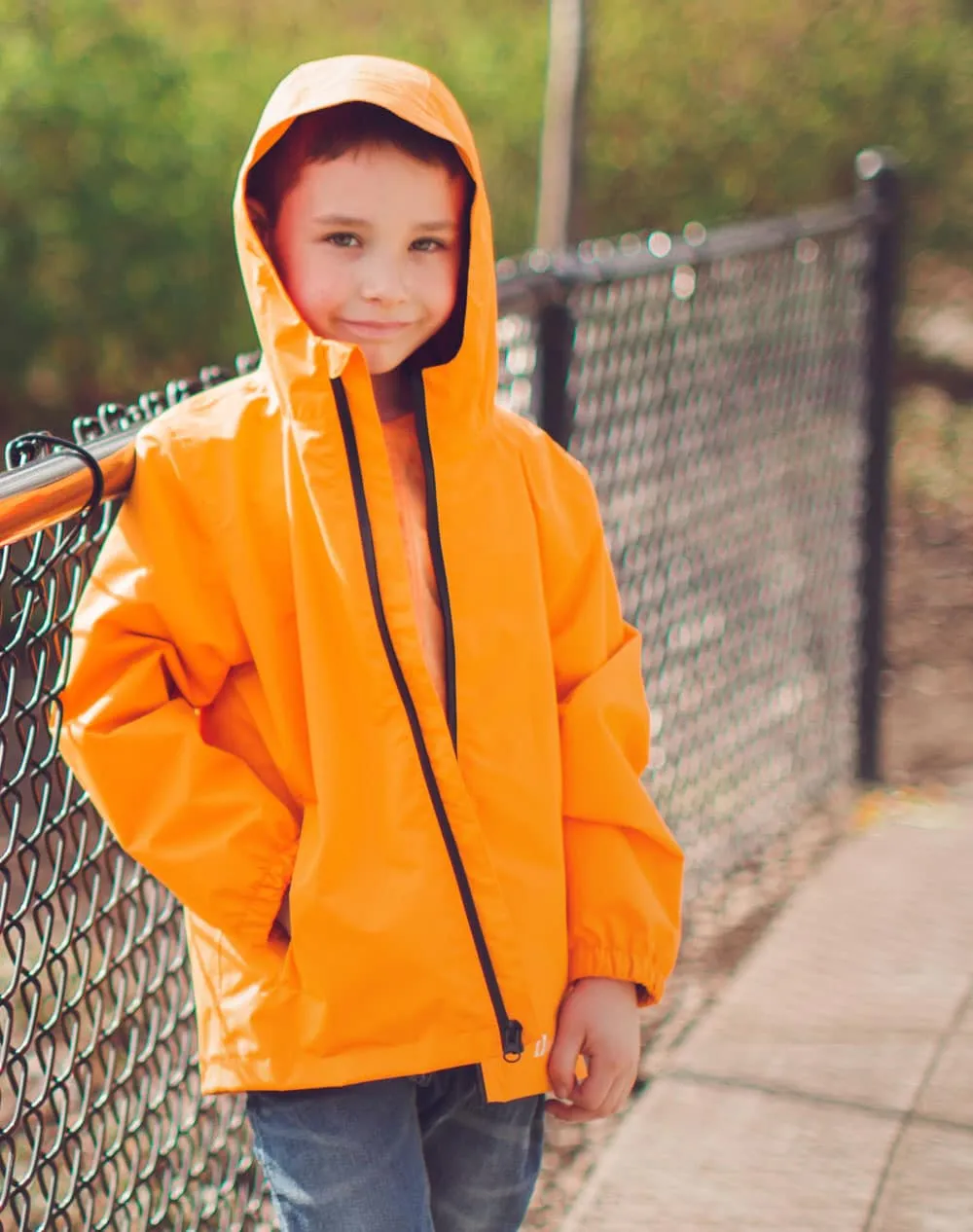 KID’S CORE RAIN JACKET LAVA ORANGE