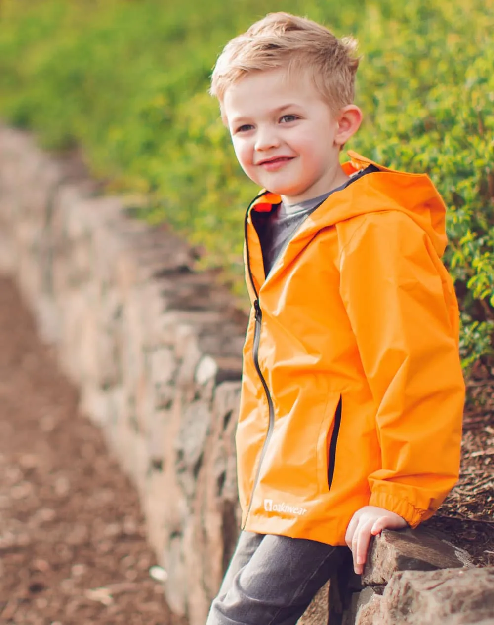 KID’S CORE RAIN JACKET LAVA ORANGE